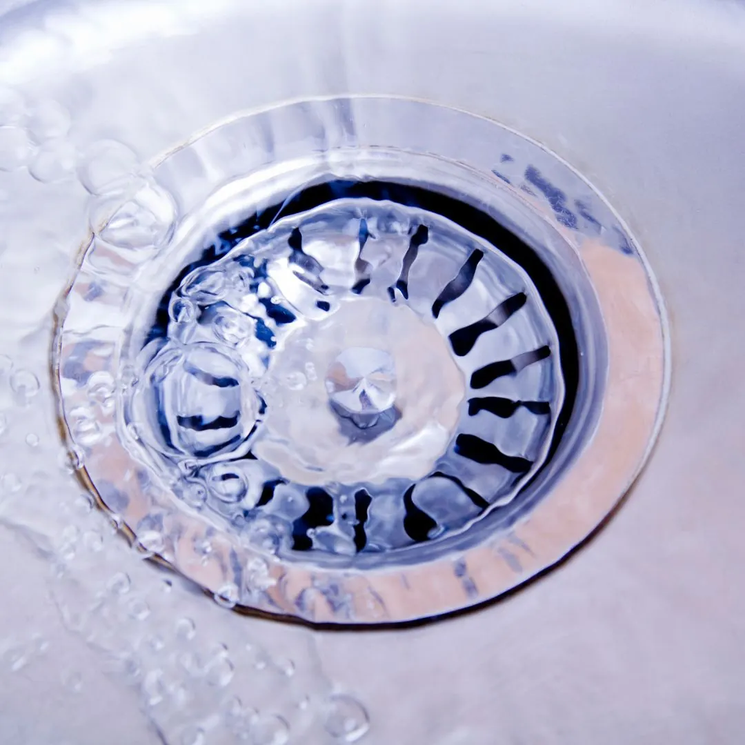 water flowing down a drain