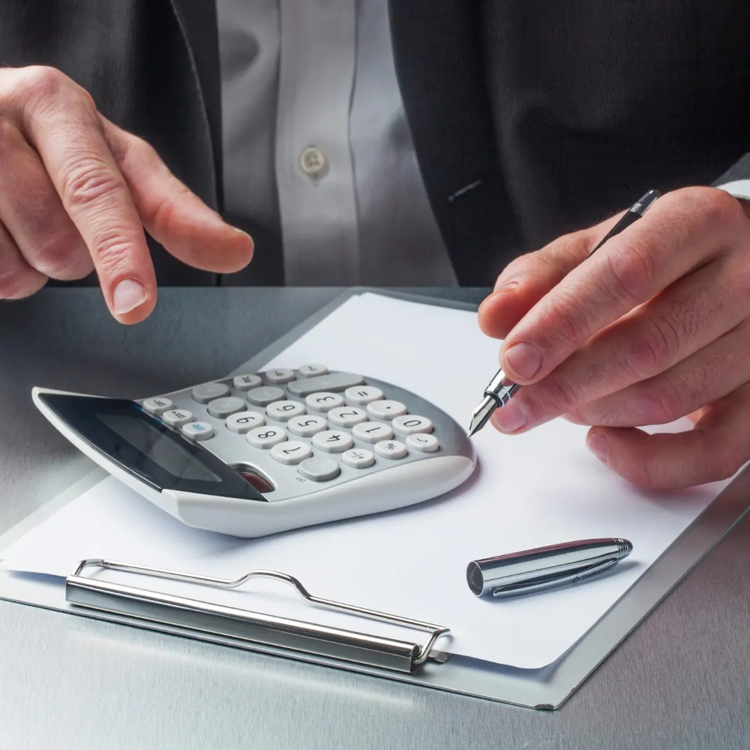 person does accounting with a calculator
