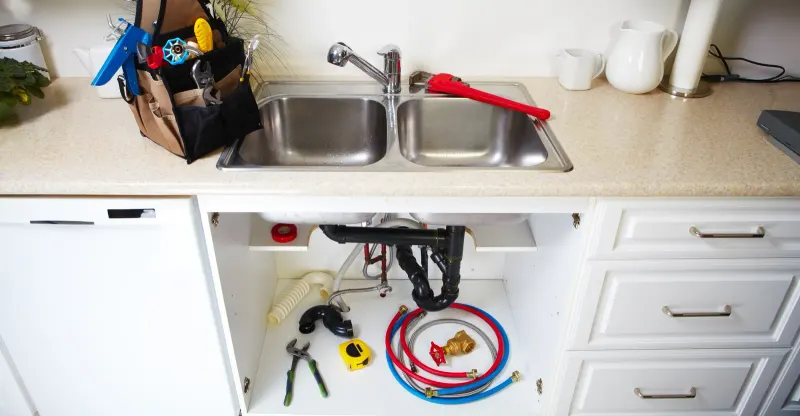 sink with plumbing lines below