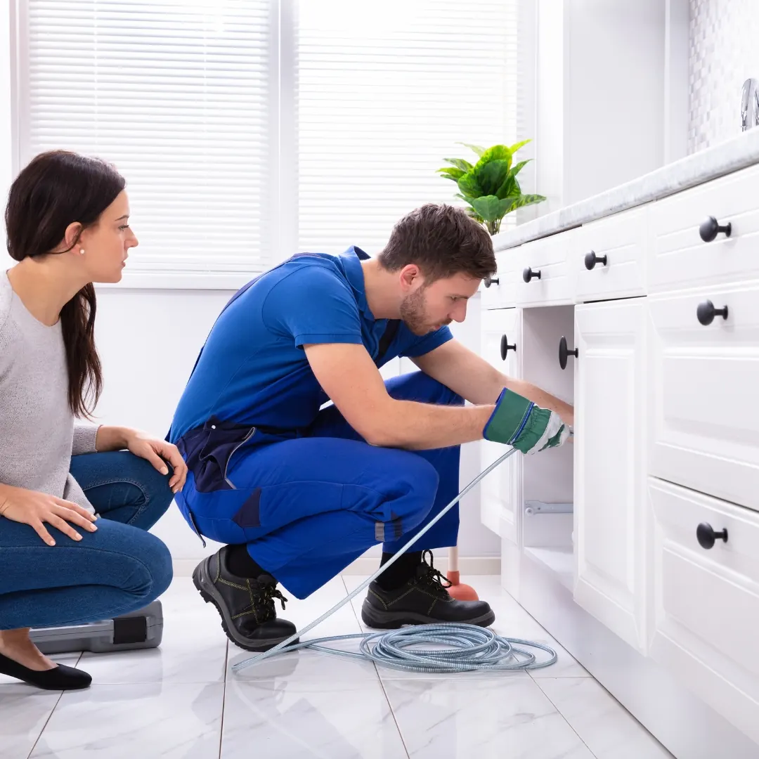 plumber snakes a drain