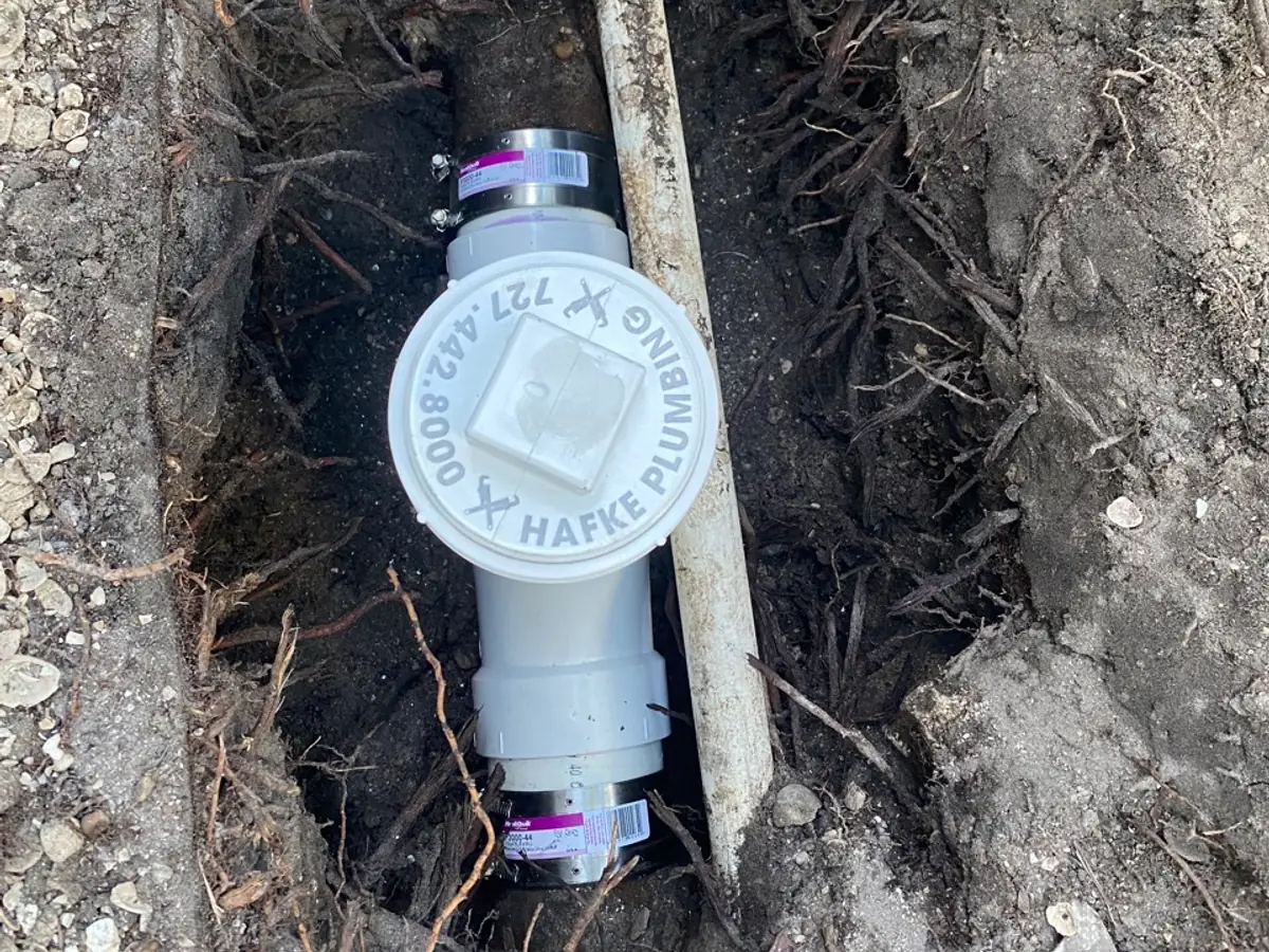 Hafke-branded cleanout installed on a newly replaced sewer line