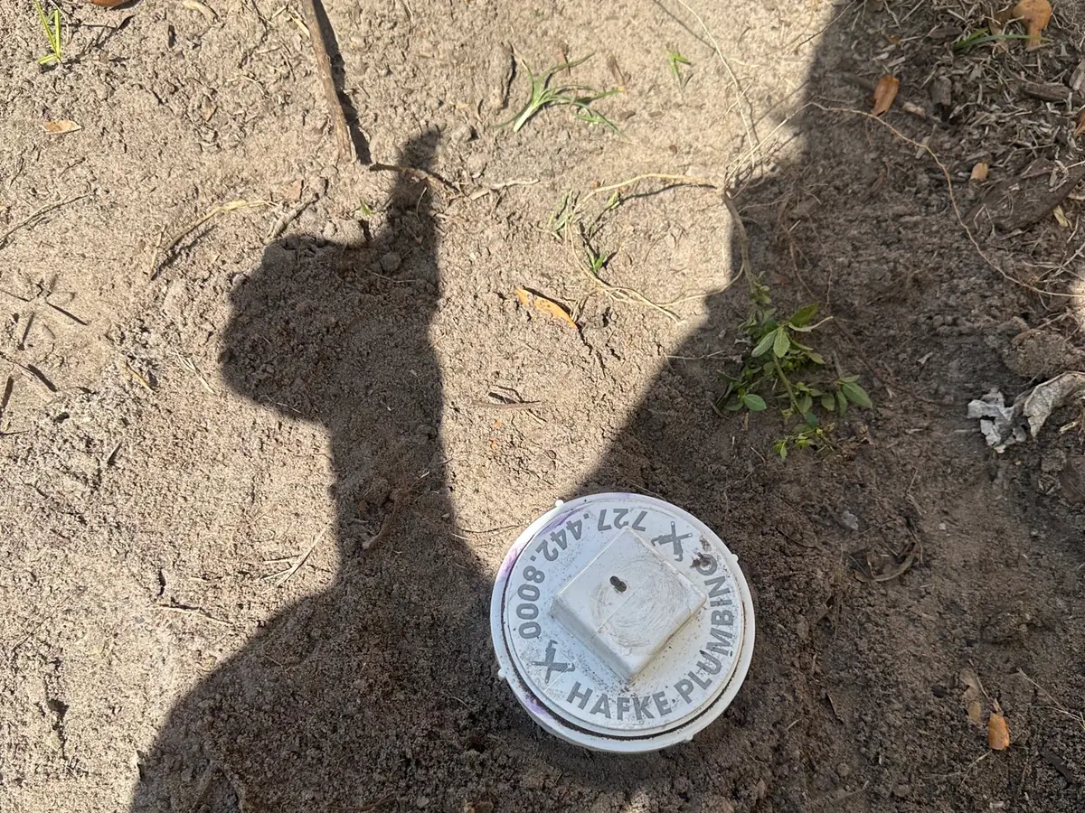 Hafke-branded sewer cleanout set in the ground after a main line repair