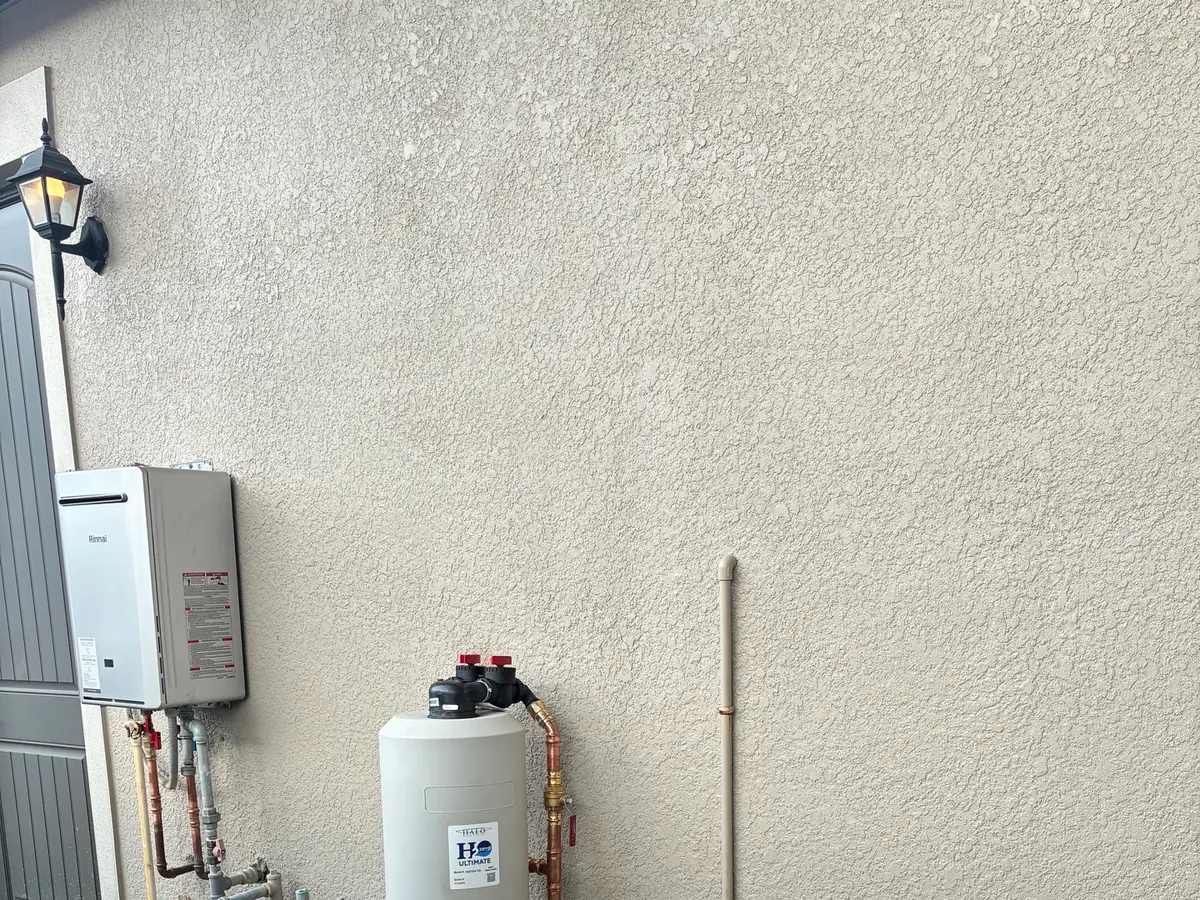 Exterior water heater and treatment equipment during a maintenance check
