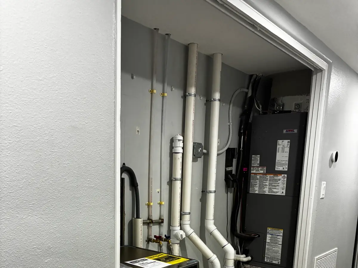 Water heater and utility piping in a laundry room