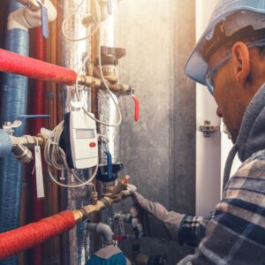 plumber working on pipes