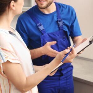 woman looks at an estimate with pen in hand 