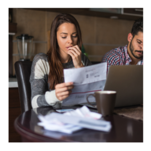 A woman looking at her water bill