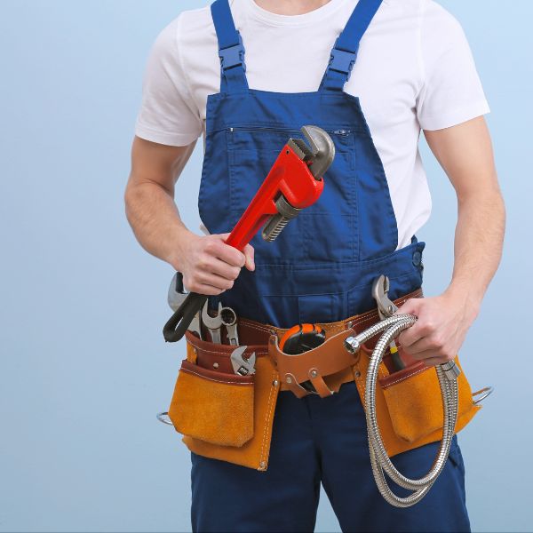 a plumber ready with his equipment