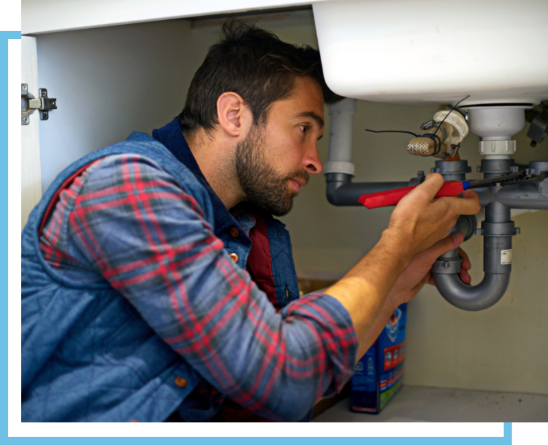 Plumber fixing a leak