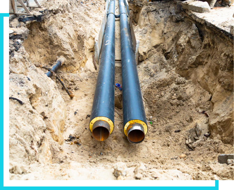 Dual high-capacity commercial sewer main pipes installed in a deep earth trench for a large-scale St. Petersburg infrastructure project.