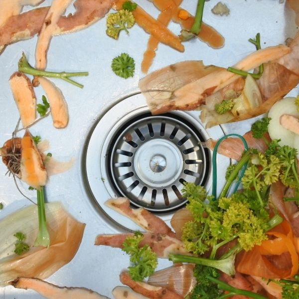 Food scraps in a kitchen sink.